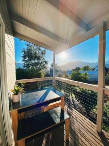 a hot tub on the deck of a house at Myrtle Casa in Mount Beauty +39 photos