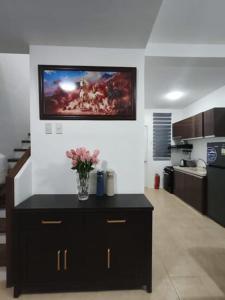 a kitchen with a vase of flowers on a counter at Casa Solana in Dao