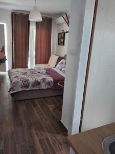 Una cama o camas en una habitación de Apartman Mata Banja Vrujci
