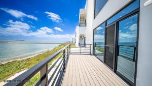 a balcony with a view of the ocean at Mondrian Seaview Guest House in Magong
