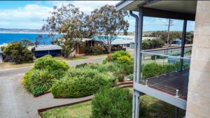 a balcony of a house with a view of the ocean at Emu Bay Bliss 'sweeping ocean views' in Emu Bay