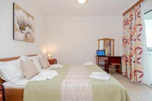 Postel nebo postele na pokoji v ubytování Apartmani Putnik