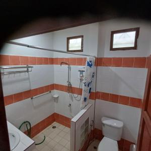 a bathroom with a shower and a toilet and a sink at Lamai viking bungalow in Koh Samui +14 photos