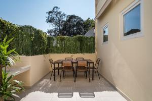 a table and chairs sitting on a patio at Terraced Apartment in the Heart of Porto - Free Parking in Porto