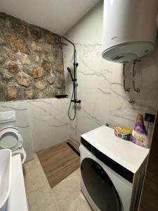 a kitchen with a sink and a microwave in a room at Beachfront Villa Amfora with Pool in Karlobag +26 photos