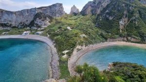 an aerial view of a beach next to the ocean at L'Isolana Case Vacanza Alloro 3 in Ponza
