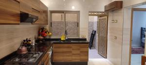 a kitchen with a stove and a counter top at Dar lala soukaina in Marrakesh