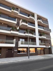an apartment building on the side of a street at Venus Suites in Bari