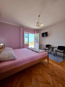 Postel nebo postele na pokoji v ubytování Guest House Pamela