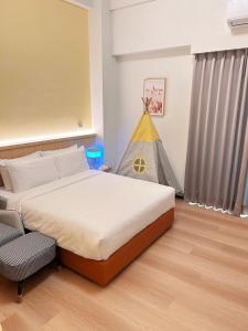 Postel nebo postele na pokoji v ubytování Orange Homestay