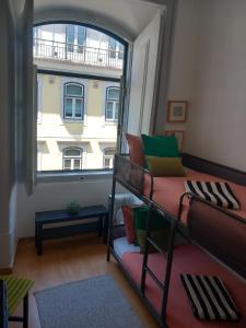 Ένα ή περισσότερα κρεβάτια σε δωμάτιο στο Chiado Home