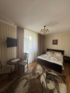 Postel nebo postele na pokoji v ubytování Сонячна Перлина