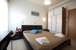 Postel nebo postele na pokoji v ubytování Hotel Graziana