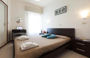 Postel nebo postele na pokoji v ubytování Hotel Graziana