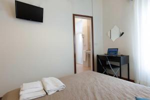 Postel nebo postele na pokoji v ubytování Hotel Graziana