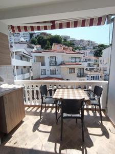 a table and chairs on a balcony with a view at Accommodation Milla in Ulcinj +10 photos