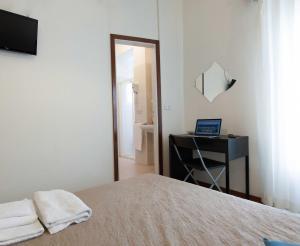 Postel nebo postele na pokoji v ubytování Hotel Graziana