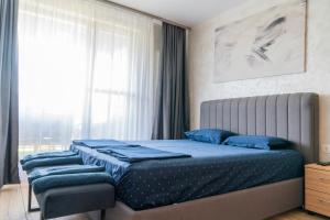 เตียงในห้องที่ Business Park Premium, 2B lux flat, free garage