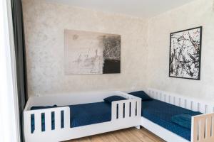 เตียงในห้องที่ Business Park Premium, 2B lux flat, free garage +10 ภาพ