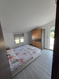 Postel nebo postele na pokoji v ubytování Plavi Horizont + 14 fotografií