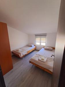 Postel nebo postele na pokoji v ubytování Plavi Horizont