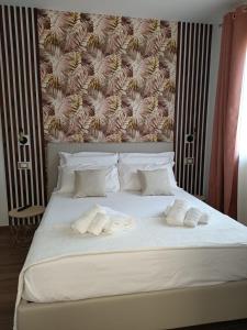 Postel nebo postele na pokoji v ubytování B&B Eterea