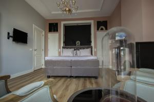 TV a/nebo společenská místnost v ubytování MUZE Hotel Utrecht