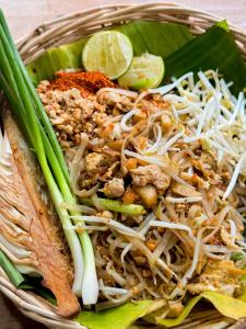 a bowl of food with noodles and other ingredients at Tueng ha เติง หา ที่พักงาว in Ban Rong +58 photos