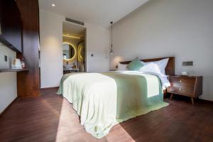 Voodi või voodid majutusasutuse 大理沙溪云喜七月精品客栈 Shaxi Ancient Town Yunxi Qiyue Guesthouse toas