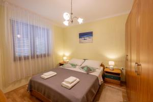 Postel nebo postele na pokoji v ubytování Apartman Sabljak