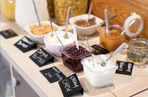 a table with different types of desserts on it at Beachfront Caparica in Costa da Caparica