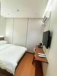 TV o dispositivi per l'intrattenimento presso 合悦精品商务酒店
