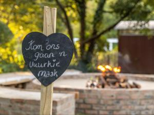 a heart sign in front of a fire place at The Huts - Glamping at Caledon Grace in Caledon