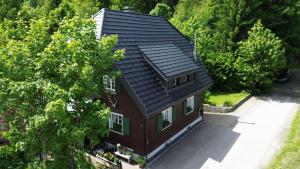 an overhead view of a house with a roof at Schwarzwaldhaus St Blasien, Direkt Am Bach in St. Blasien