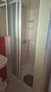 a shower with a glass door in a bathroom at Ribarićevi dvori in Banjol +23 photos