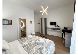 Postel nebo postele na pokoji v ubytování Dama Suite