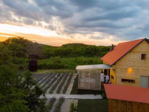 a house with a red roof and a set of stairs at WOWCABIN - Lovas in Lovas +15 photos