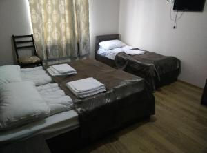 Rúm í herbergi á Hotel Mimino