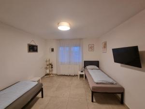 Ένα ή περισσότερα κρεβάτια σε δωμάτιο στο Residence Apartments