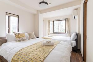 Llit o llits en una habitació de perfect life緑橋
