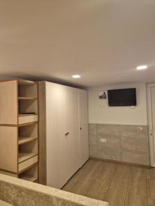 a living room with a tv on the wall at Palanga S3 in Palanga