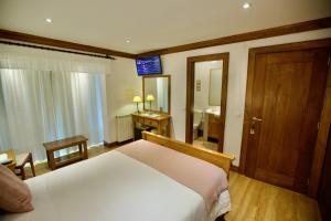 Uma cama ou camas num quarto em Quinta de CasalMato