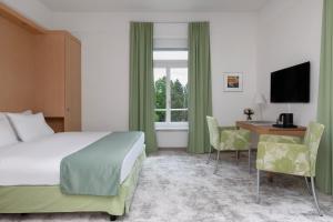 Postel nebo postele na pokoji v ubytování Grand Hotel Europe + 22 fotografií