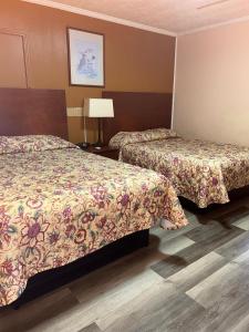 Ένα ή περισσότερα κρεβάτια σε δωμάτιο στο Deavers motel