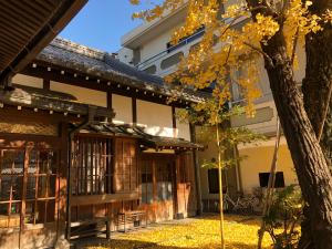 a building with a tree in front of it at 102 山手线近上野一站温馨新公寓 in Tokyo
