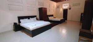 Ein Bett oder Betten in einem Zimmer der Unterkunft Hyba Heritage Guest House