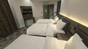 Postel nebo postele na pokoji v ubytování Samama Ajyad Hotel Makkah