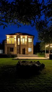 a large house at night with lights on it at Canyon View Dsegh in Dsegh
