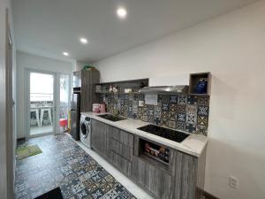 Kuchyň nebo kuchyňský kout v ubytování Deluxe Apartment