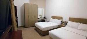 Ein Bett oder Betten in einem Zimmer der Unterkunft Hyba Heritage Guest House